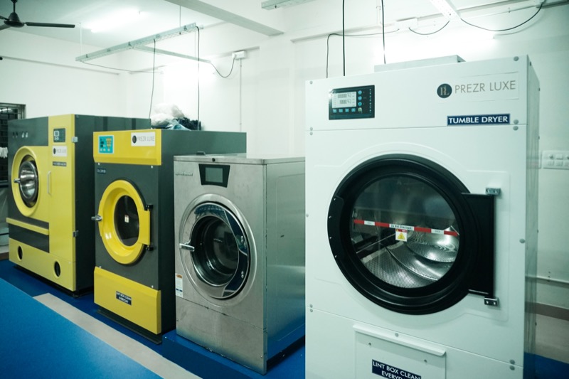 Dry cleaning and drying machines on the plant floor of the studio
